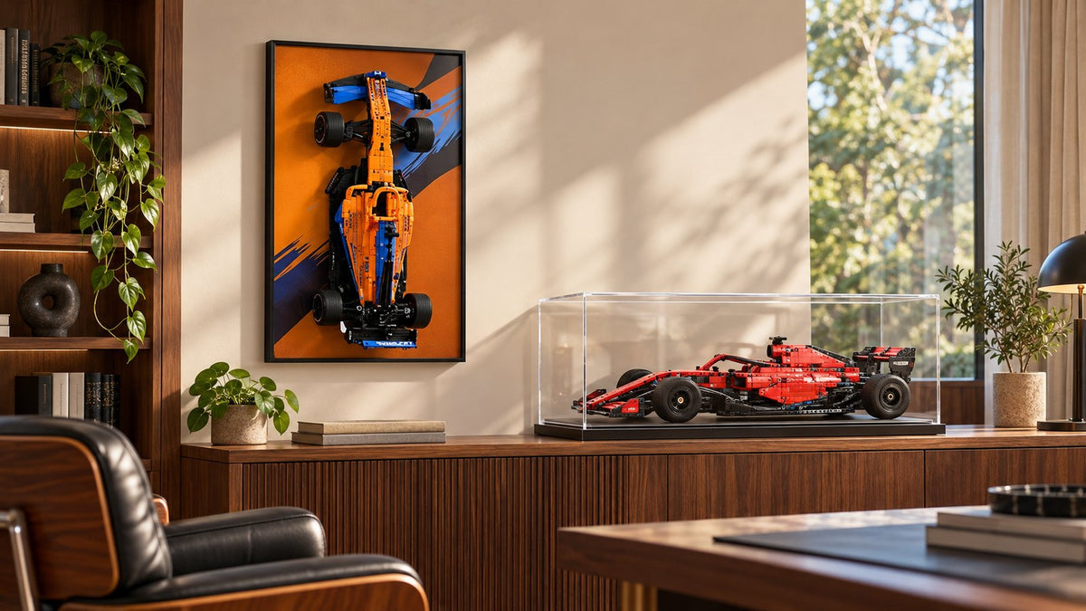 LEGO Technic compatible wall display frame beside a transparent tabletop display case in an adult collector's study.