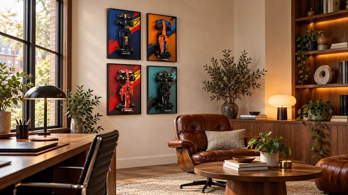 Adult collector home office with four LEGO Technic compatible F1 wall display frames arranged in a two-by-two gallery wall.