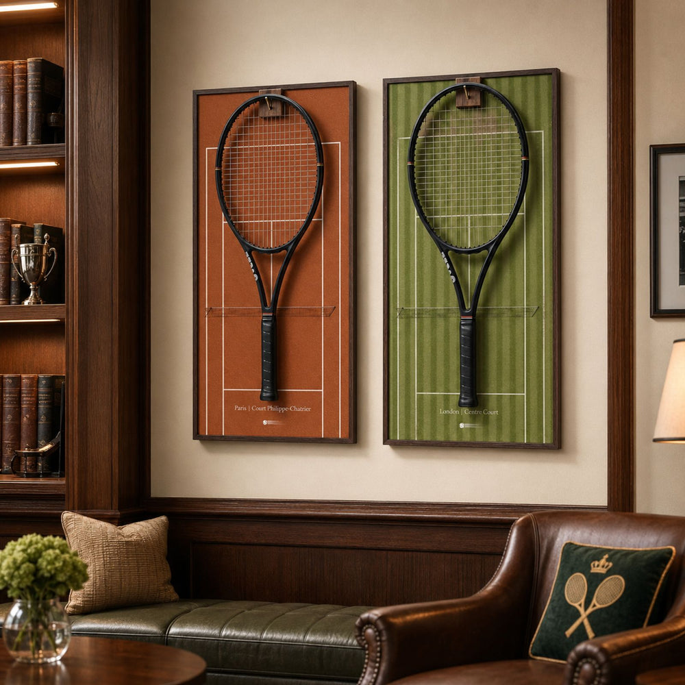 Front view of the ONE MAAY French Open-inspired tennis racket wall display, featuring a dark wood colored aluminum frame and a rich red clay court background holding a black tennis racket.