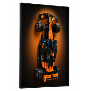 ONE MAAY Halo wall display frame for LEGO Technic 42228 McLaren F1 MCL39 — top-down view of papaya orange Formula 1 race car model on black framed panel