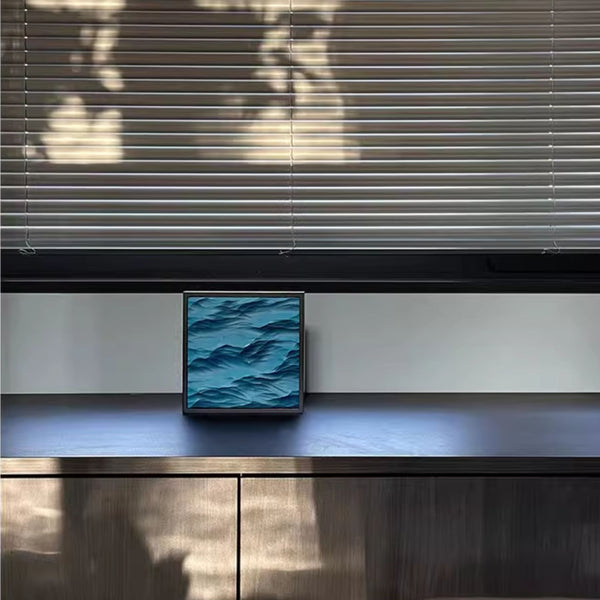 Modern interior with a blue 3D carved painting on a tabletop