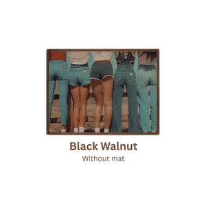 Black walnut picture frame with a cutout of people wearing teal overalls on a white background. Without mat.