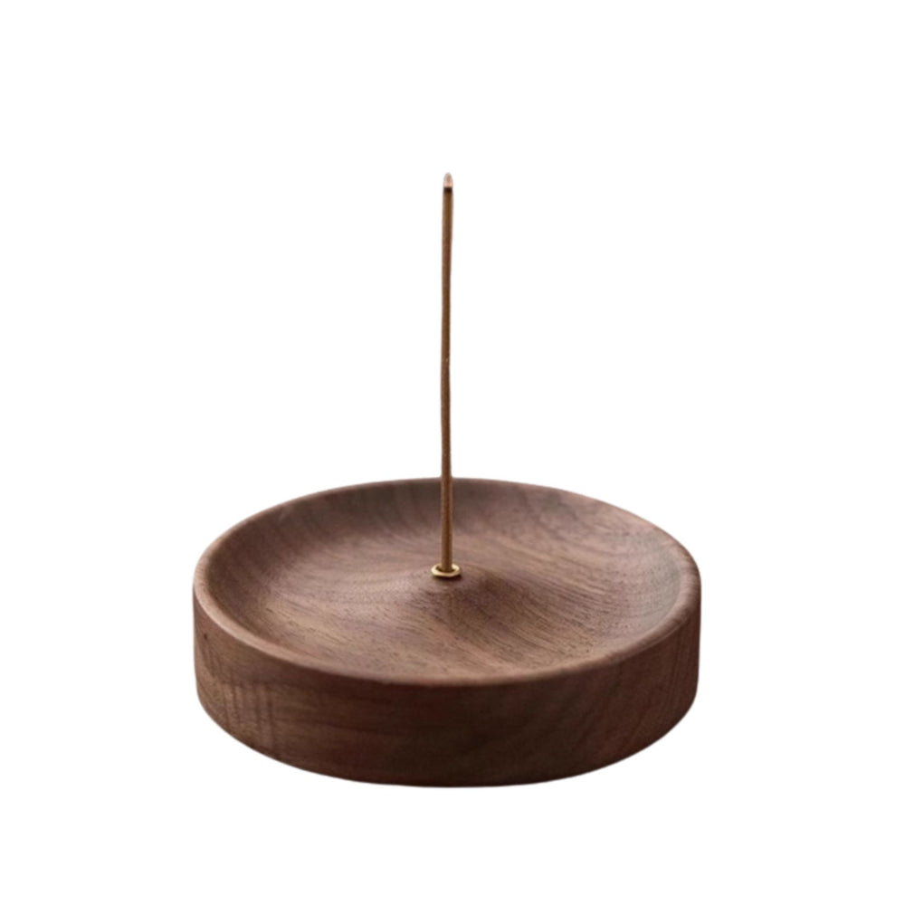 black walnut wood incense holder with a single incense stick on a white background