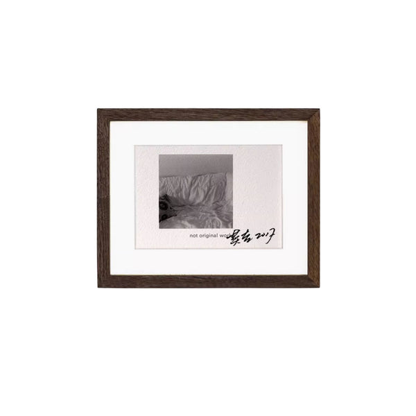 Black walnut wood framed black and white photograph with text on a white background