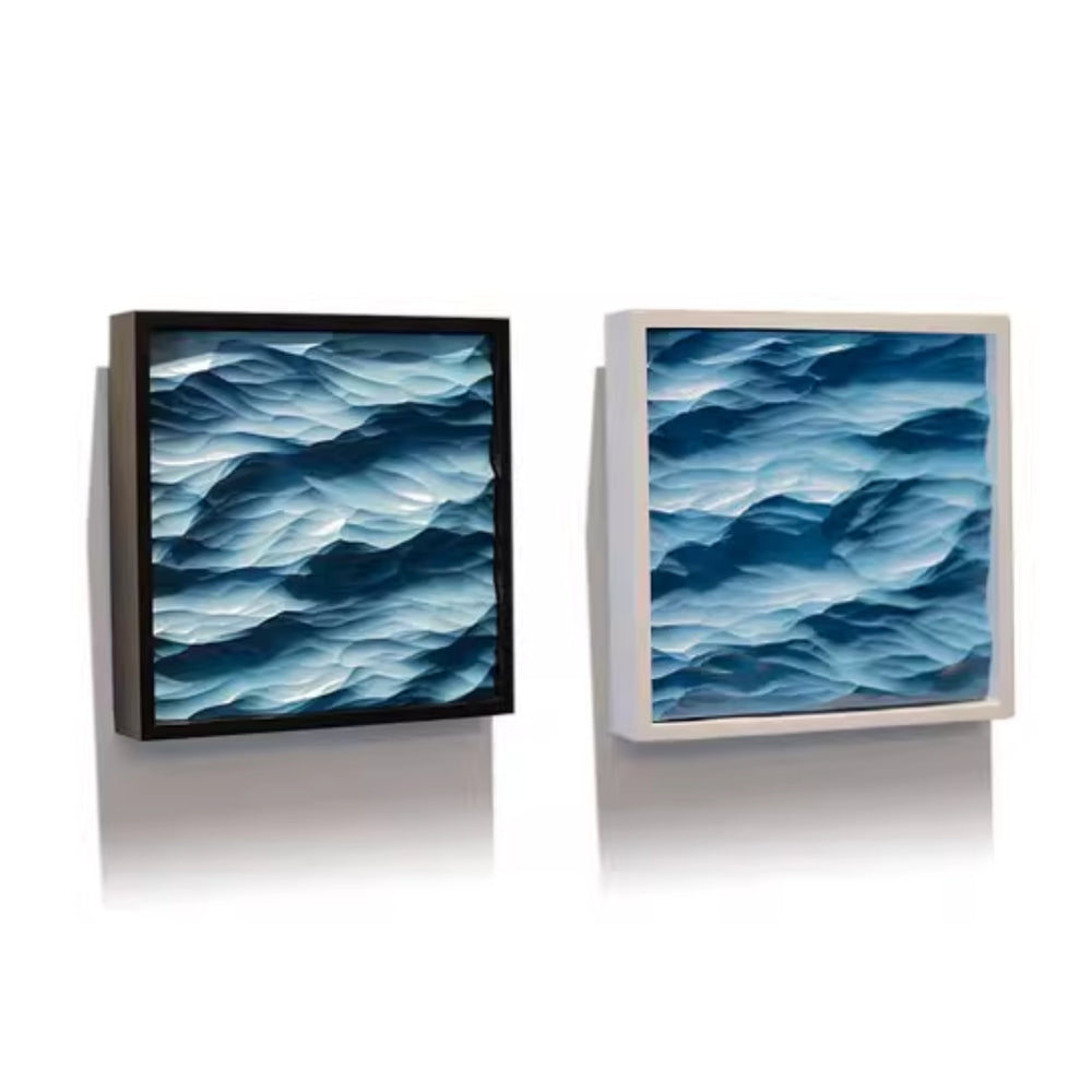 A black and white framed artworks depicting blue wave patterns on a white background