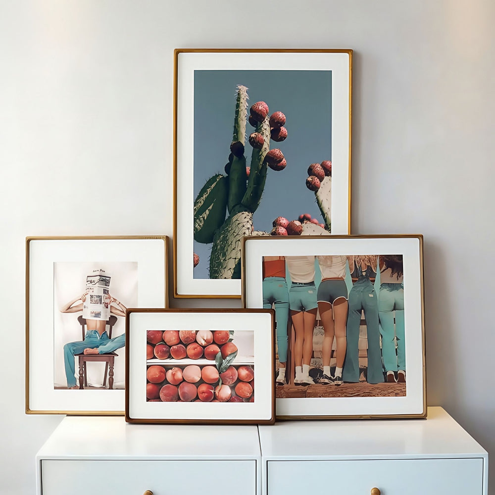 Four wooden frames in different finishes labeled 'Teak', 'White ash', 'Black walnut', and 'Merbau' on a white background.