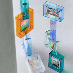 Colorful acrylic picture frame stacked on a white background. 