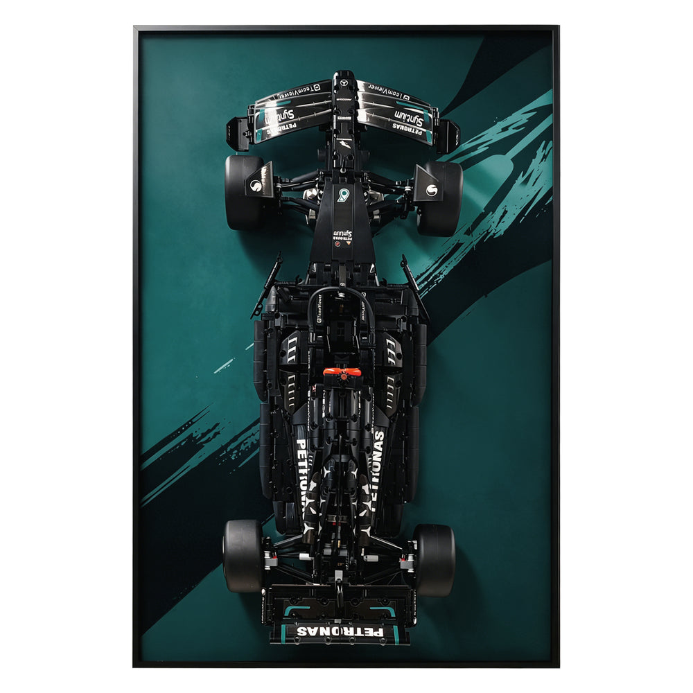 ONE MAAY Display frame, model of a Formula 1 LEGO 42171 car with a black, and green design on a dark green wall display frame