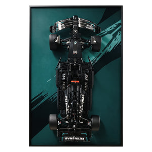 ONE MAAY Display frame, model of a Formula 1 LEGO 42171 car with a black, and green design on a dark green wall display frame