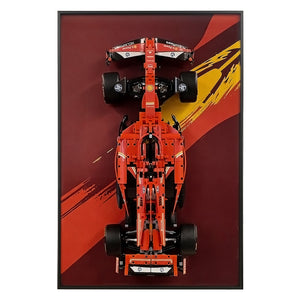 ONE MAAY Display frame, model of a Formula 1 LEGO 42207 car with a red, and yellow design on a dark red wall display frame