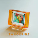Transparent orange photo frame with a display of smoothies on a white background, featuring the word 'Tangerine'.
