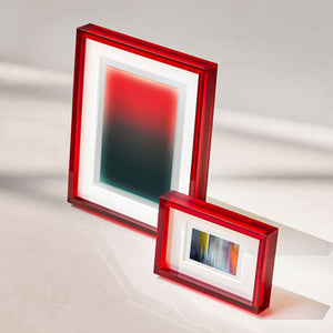 Two burgundy red picture frames on a light gray background