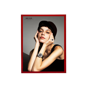 Red burgendy thick acrylic picture frame showing a woman wearing a watch with a red border on a gray background