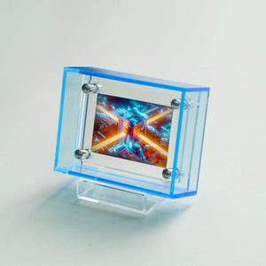 Small sky blue picture frame display with colorful abstract design inside a transparent blue frame on a light gray background