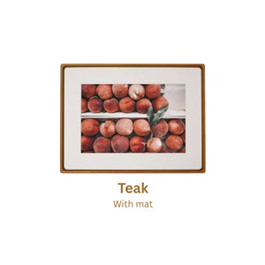 Teak framed artwork of peaches with a teak frame and mat on a white background