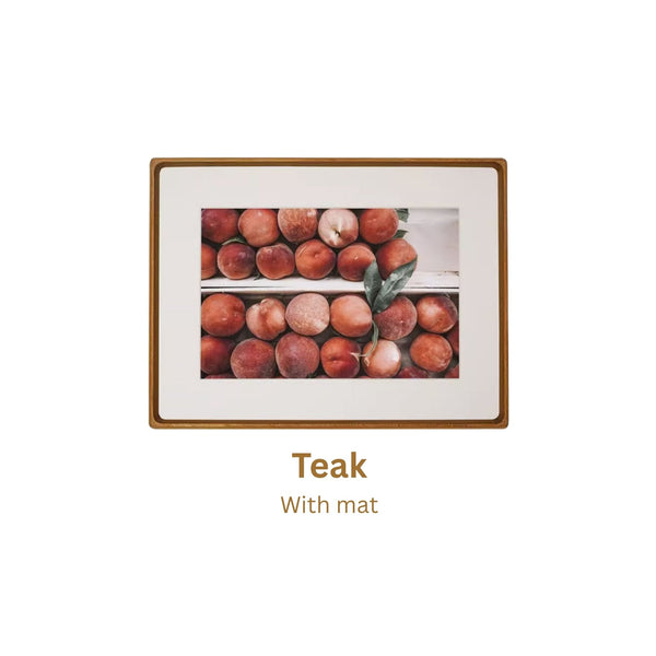 Teak framed artwork of peaches with a teak frame and mat on a white background