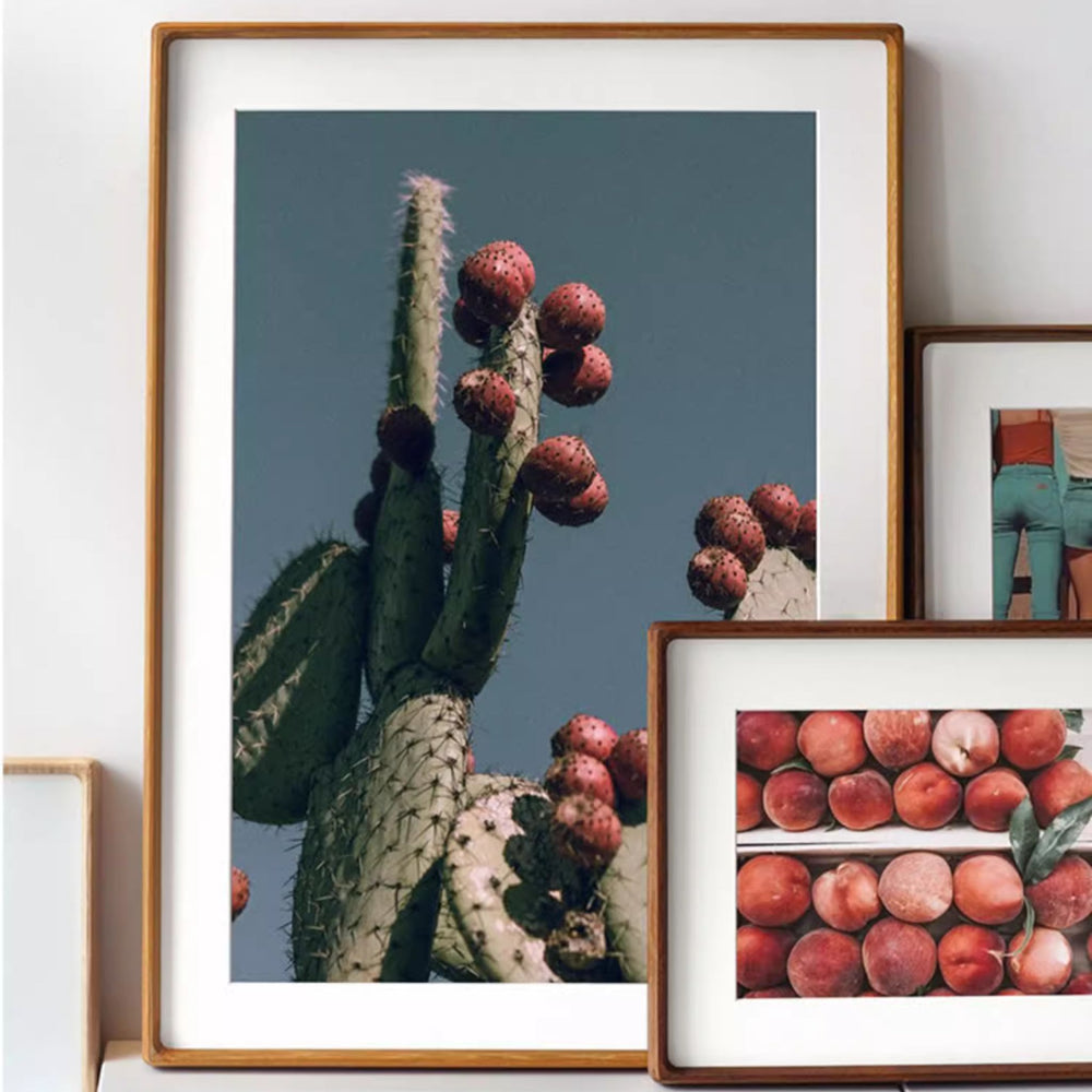 Two merbau wood framed pictures side by side, one without a mat and one with a mat, on a white background.