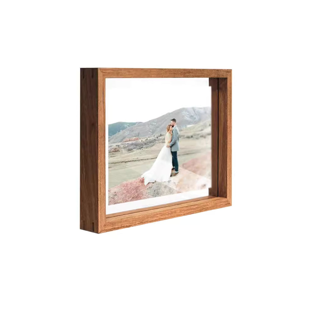 Transparent teak photo frame with a scenic landscape and a couple inside
