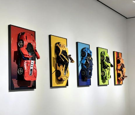 Five LEGO Technic Supercar compatible wall art frames on a white wall.