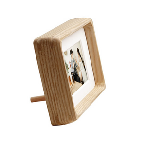 White ash wooden photo frame with a picture of a couple on a white background