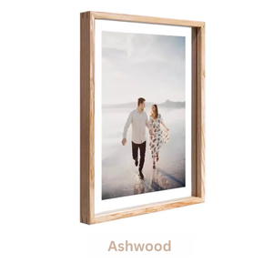 Wooden picture frame with a photo of a couple on a beach, labeled 'Ashwood'. White ash wood