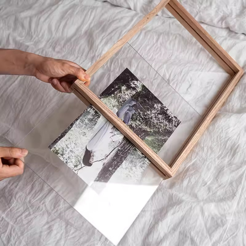 White ash wood picture frame with a photo of a couple on a beach with white background