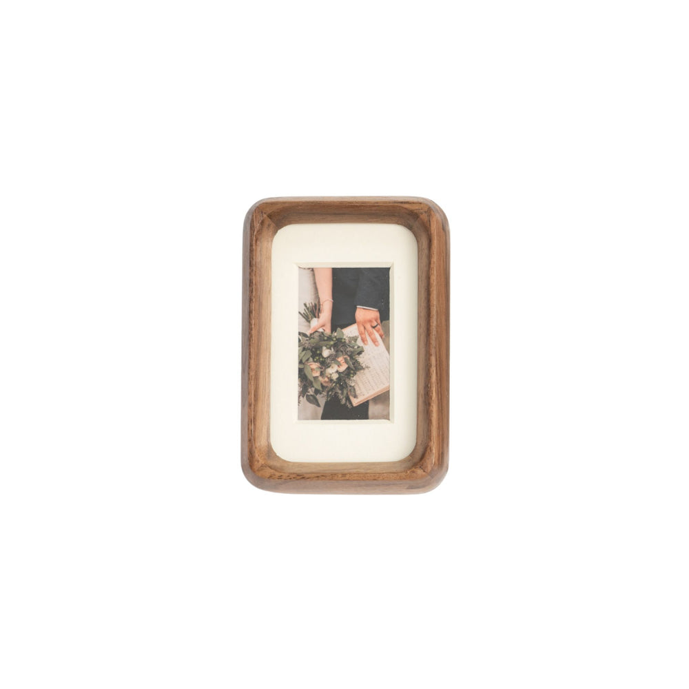 Wooden black walnut photo frame with a small picture inside on a white mat - mini palm size