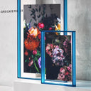 Blue thick large acrylic picture frames in a light gray background