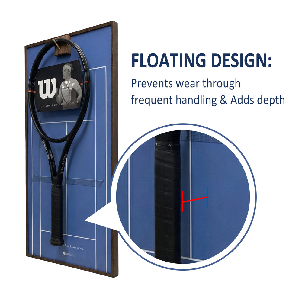Close-up showing the floating design of the ONE MAAY tennis racket display, highlighting how the racket hovers over the blue hard court background to prevent wall damage