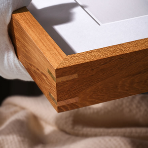 Close-up of a wooden frame corner with a white background