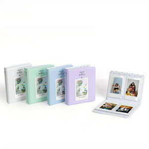Set of photo albums in different colors with an open album showing photos on a white background