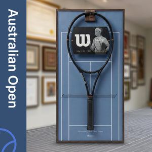 A ONE MAAY Australian Open-inspired blue hard court tennis racket wall display mounted elegantly next to a wooden bookshelf in a home library, featuring a dark blue side banner that reads "Australian Open"