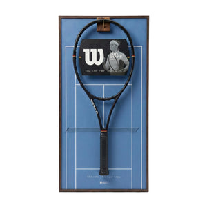 Front view of the ONE MAAY Australian Open-inspired tennis racket wall display, featuring a dark wood colored aluminum frame and a signature Melbourne blue hard court background holding a black tennis racket