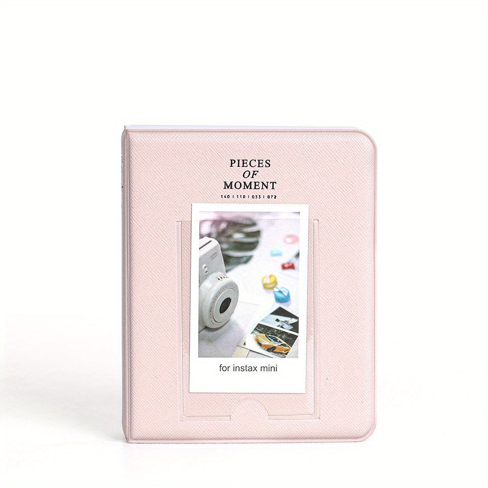 Pink photo album for Instax mini with 'Pieces of Moment' text on a white background