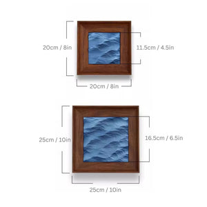 Two wooden-framed blue artworks with dimensions labeled on a white background