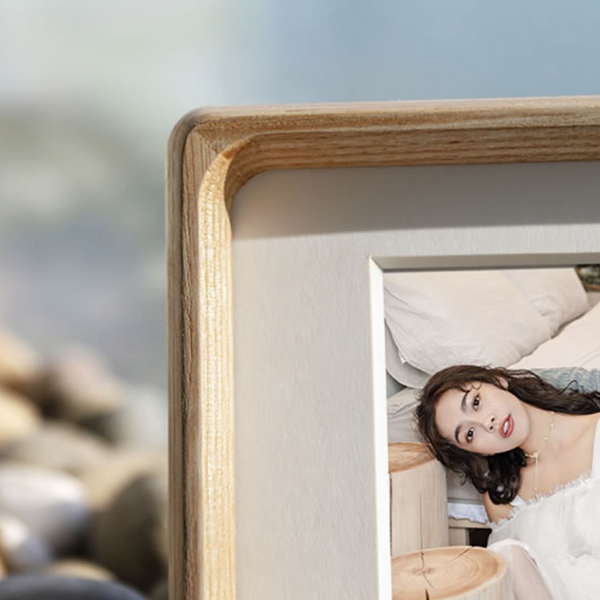 white ash wood picture frame, close-up corner shot, blurred background