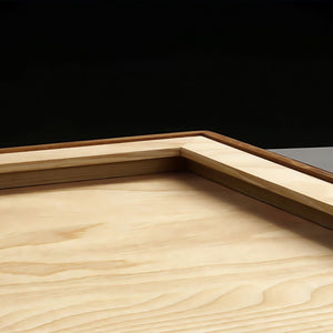 Wooden surface showing the back of the wall hanging frame